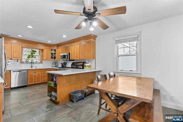kitchen with stainless steel appliances, open shelves, a peninsula, tasteful backsplash, and ceiling fan