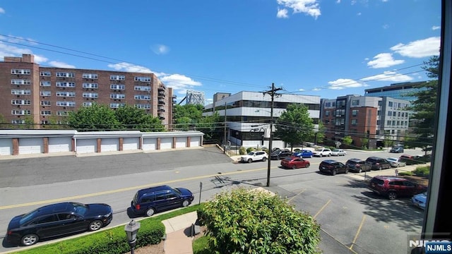 view of building exterior with uncovered parking