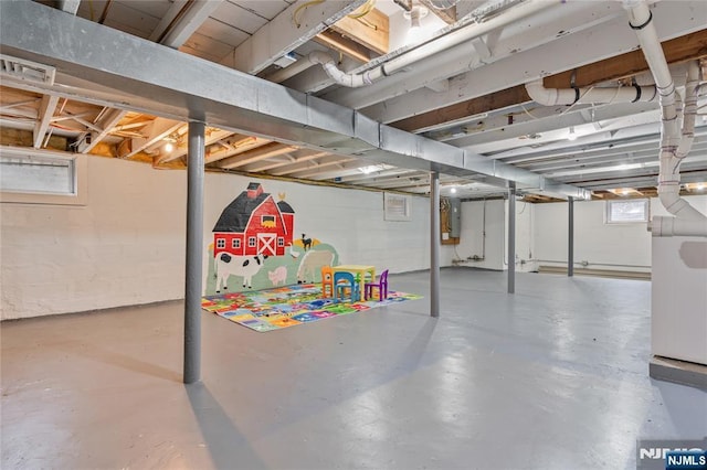 basement featuring a healthy amount of sunlight and visible vents