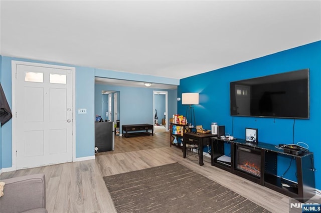living room with wood finished floors and baseboards