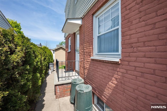 view of side of property featuring central AC unit