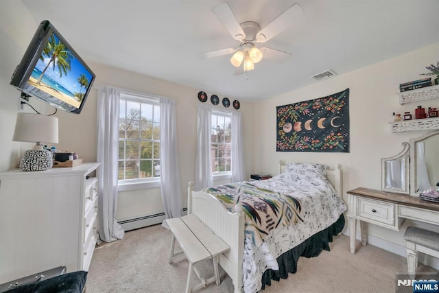 bedroom featuring light colored carpet, visible vents, a ceiling fan, and a baseboard heating unit
