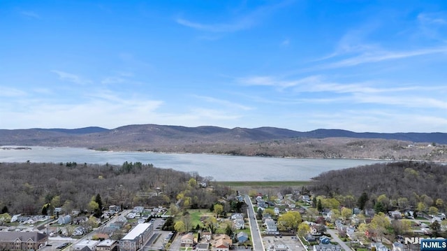 aerial view featuring a residential view and a water and mountain view