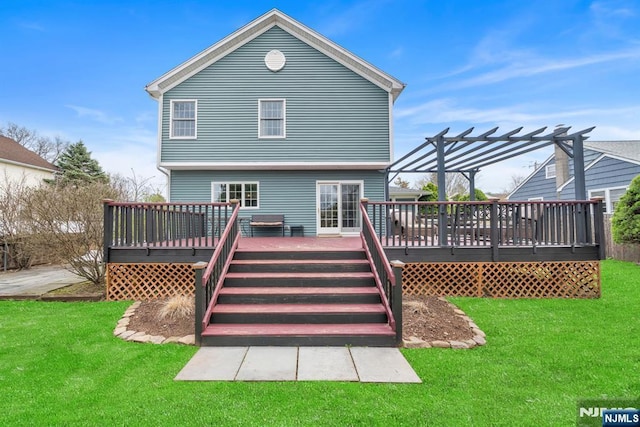 rear view of property with a wooden deck, a yard, and a pergola