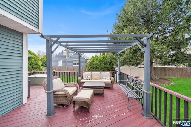 wooden deck featuring a shed, an outdoor hangout area, a jacuzzi, and a fenced backyard