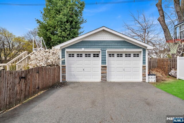 detached garage with fence