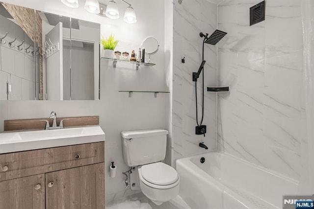 full bath featuring toilet, vanity, and shower / washtub combination