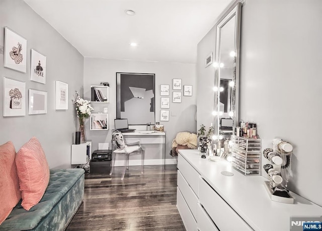 bathroom featuring wood finished floors and recessed lighting