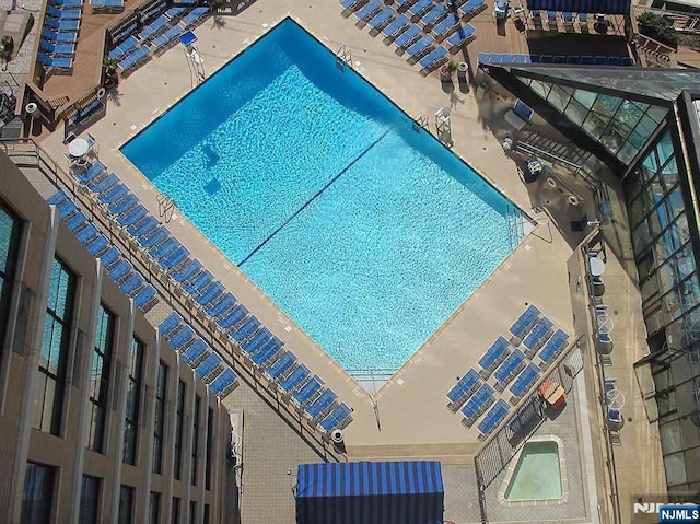 community pool featuring a patio