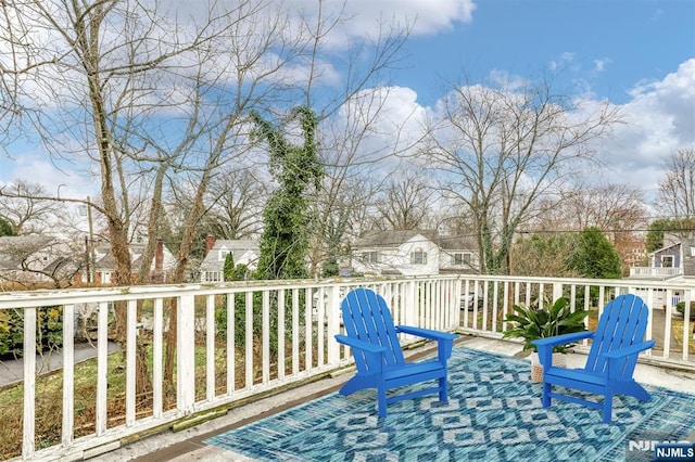 wooden terrace with a residential view