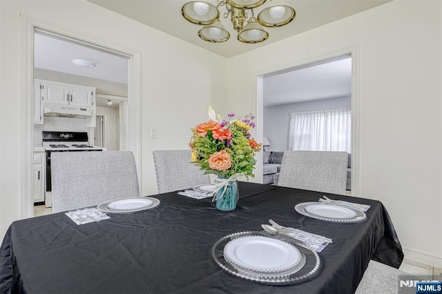 dining room featuring a notable chandelier