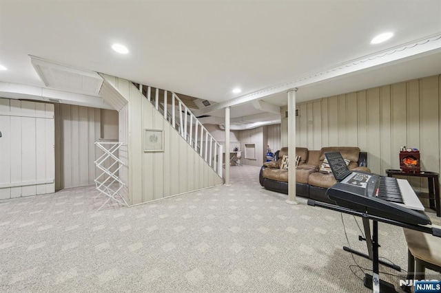 living area featuring recessed lighting, stairs, and carpet