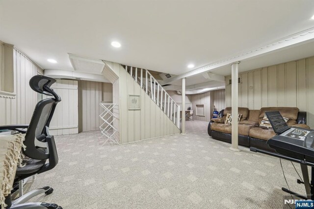 interior space with recessed lighting, a decorative wall, carpet, and visible vents