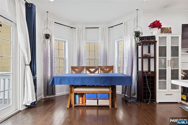 living area with ornamental molding and hardwood / wood-style flooring