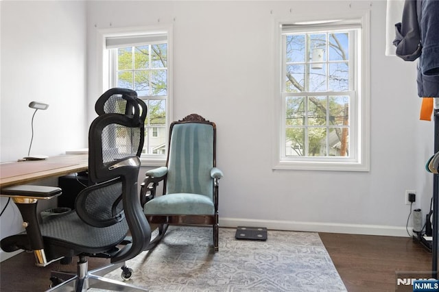 office area featuring baseboards and wood finished floors