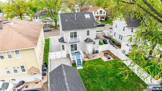 birds eye view of property with a residential view