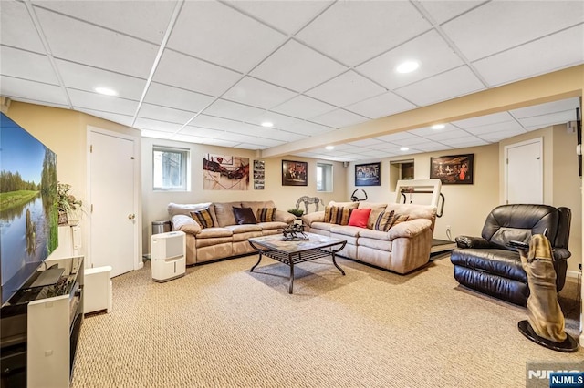 carpeted living room featuring a paneled ceiling and recessed lighting