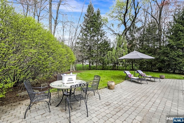 view of patio featuring outdoor dining area
