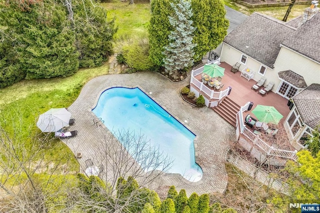outdoor pool featuring a wooden deck