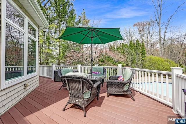 wooden terrace with outdoor lounge area