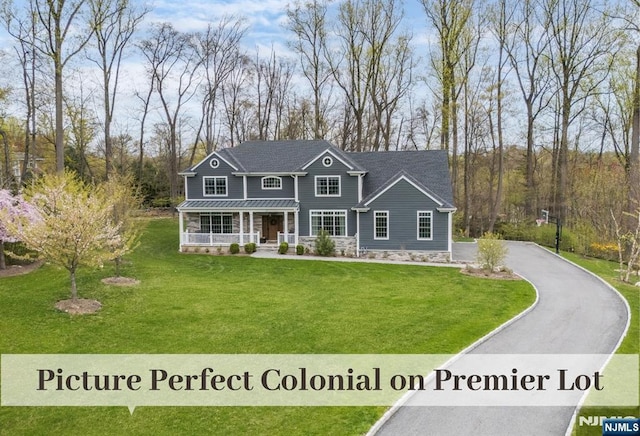 21 Flintlock Rd, Montvale, NJ 07645 - craftsman-style home featuring a front lawn, covered porch, and driveway