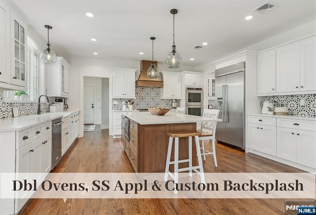 21 Flintlock Rd, Montvale, NJ 07645 - kitchen with tasteful backsplash, stainless steel appliances, white cabinets, and visible vents
