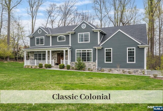 21 Flintlock Rd, Montvale, NJ 07645 - craftsman inspired home featuring a porch, stone siding, and a front yard