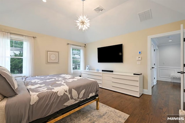 bedroom with multiple windows, visible vents, and dark wood-style flooring