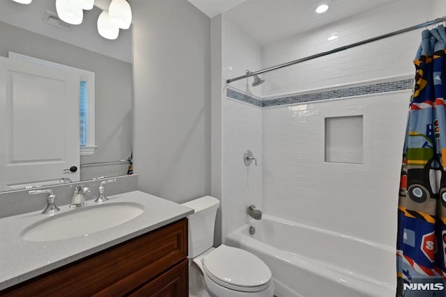full bath featuring vanity, toilet, visible vents, and shower / bath combo