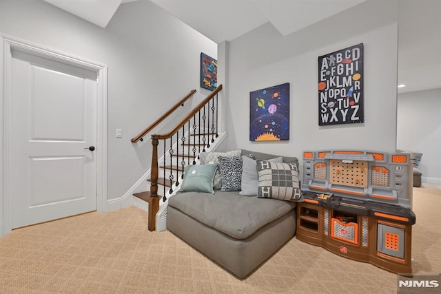 interior space featuring baseboards, carpet flooring, and stairway