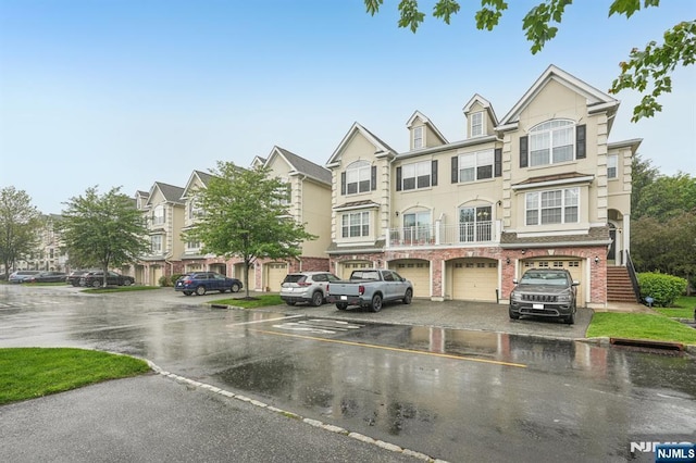 150 Blue Heron Dr, Secaucus, NJ 07094 - multi unit property featuring a garage, driveway, and brick siding
