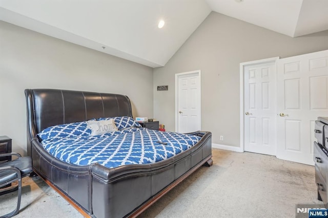 150 Blue Heron Dr, Secaucus, NJ 07094 - bedroom featuring light carpet, baseboards, and high vaulted ceiling