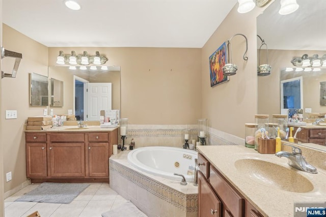 150 Blue Heron Dr, Secaucus, NJ 07094 - bathroom featuring two vanities, a whirlpool tub, and tile patterned floors