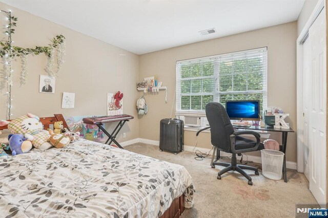 150 Blue Heron Dr, Secaucus, NJ 07094 - bedroom with a closet, carpet, baseboards, an office area, and cooling unit