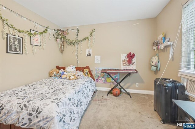 150 Blue Heron Dr, Secaucus, NJ 07094 - bedroom featuring light carpet and baseboards