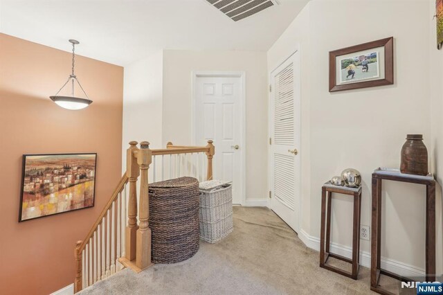 150 Blue Heron Dr, Secaucus, NJ 07094 - hall featuring an upstairs landing, carpet floors, and baseboards