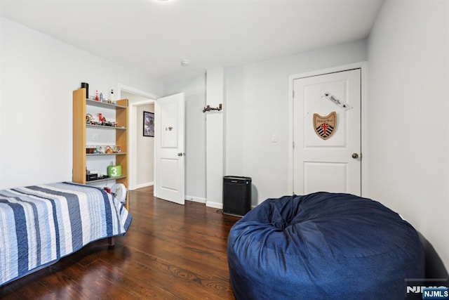 bedroom with wood finished floors