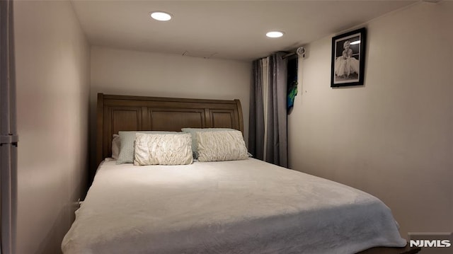 bedroom featuring recessed lighting
