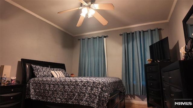 bedroom with a ceiling fan, wood finished floors, and crown molding