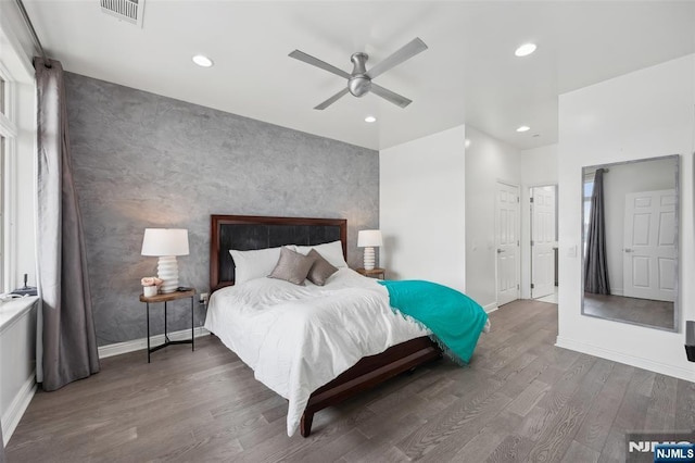 7400 River Rd Unit 431, North Bergen, NJ 07047 - bedroom featuring an accent wall, wood finished floors, recessed lighting, baseboards, and a ceiling fan