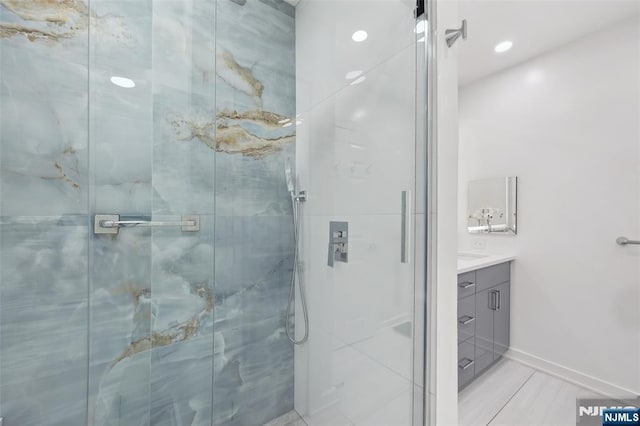 7400 River Rd Unit 431, North Bergen, NJ 07047 - bathroom featuring vanity, a shower stall, baseboards, and recessed lighting