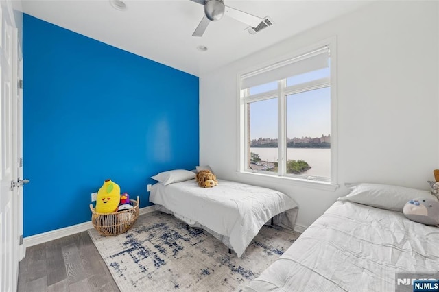 7400 River Rd Unit 431, North Bergen, NJ 07047 - bedroom featuring wood finished floors, a ceiling fan, and baseboards
