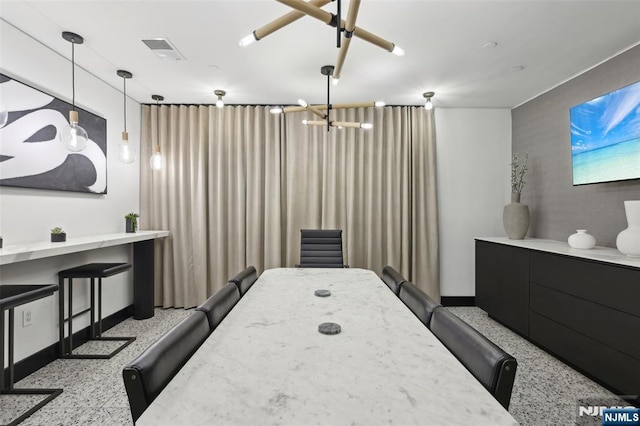 7400 River Rd Unit 431, North Bergen, NJ 07047 - bedroom featuring baseboards, speckled floor, and a chandelier