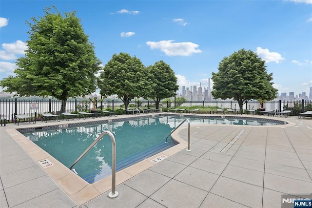 7400 River Rd Unit 431, North Bergen, NJ 07047 - community pool featuring a skyline view and a patio