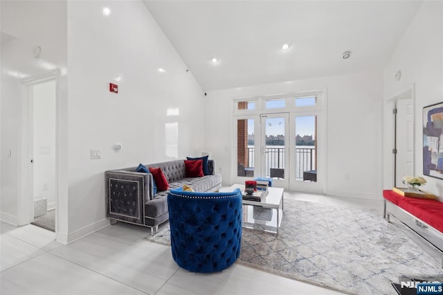 7400 River Rd Unit 431, North Bergen, NJ 07047 - living area with baseboards, high vaulted ceiling, a water view, and recessed lighting