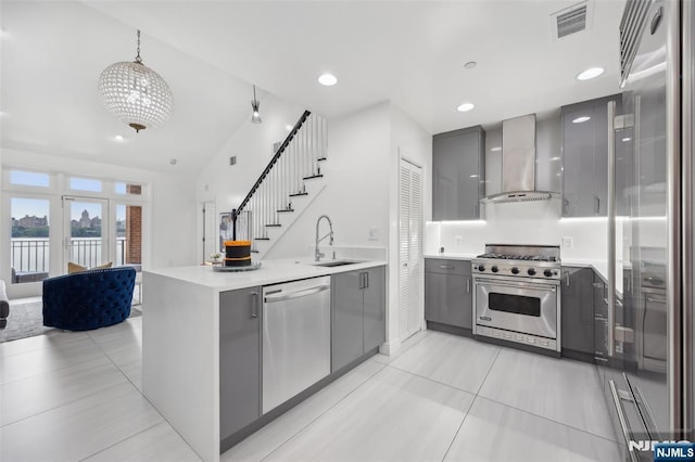 7400 River Rd Unit 431, North Bergen, NJ 07047 - kitchen featuring premium appliances, gray cabinets, wall chimney exhaust hood, modern cabinets, and recessed lighting