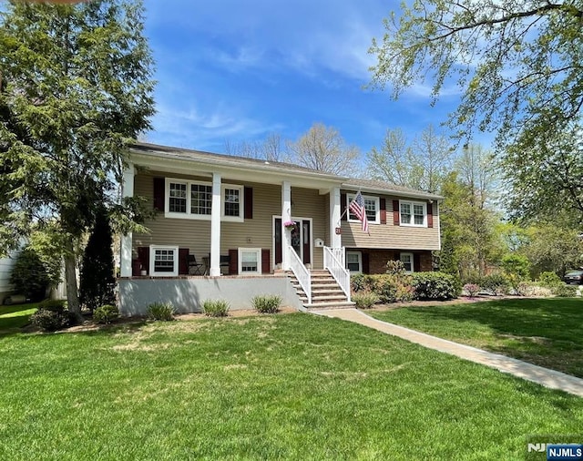 bi-level home with a front yard
