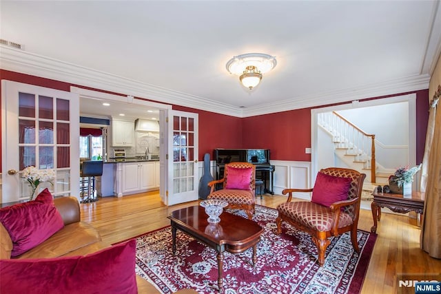 38 Farley Pl, Allendale, NJ 07401 - living room with ornamental molding, french doors, and light wood finished floors