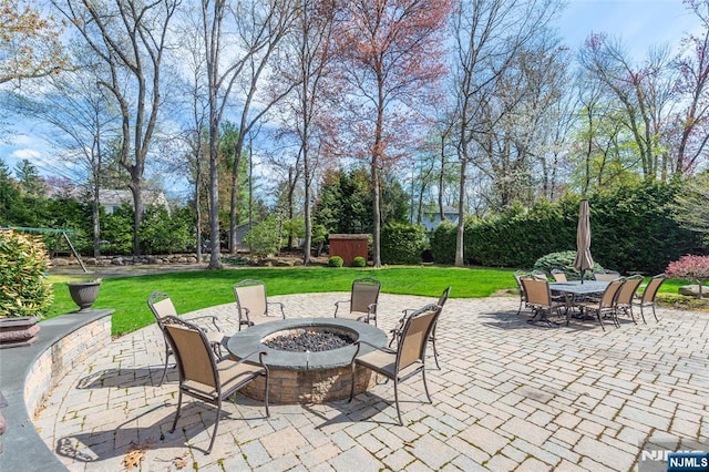 38 Farley Pl, Allendale, NJ 07401 - view of patio featuring a fire pit, outdoor dining space, and a storage shed