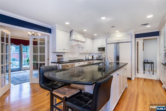 38 Farley Pl, Allendale, NJ 07401 - kitchen featuring crown molding, a sink, gas stovetop, premium range hood, and stainless steel microwave